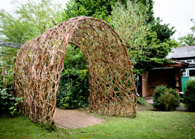 A photo of the completed play area. This is an arch made from sustainable materials.